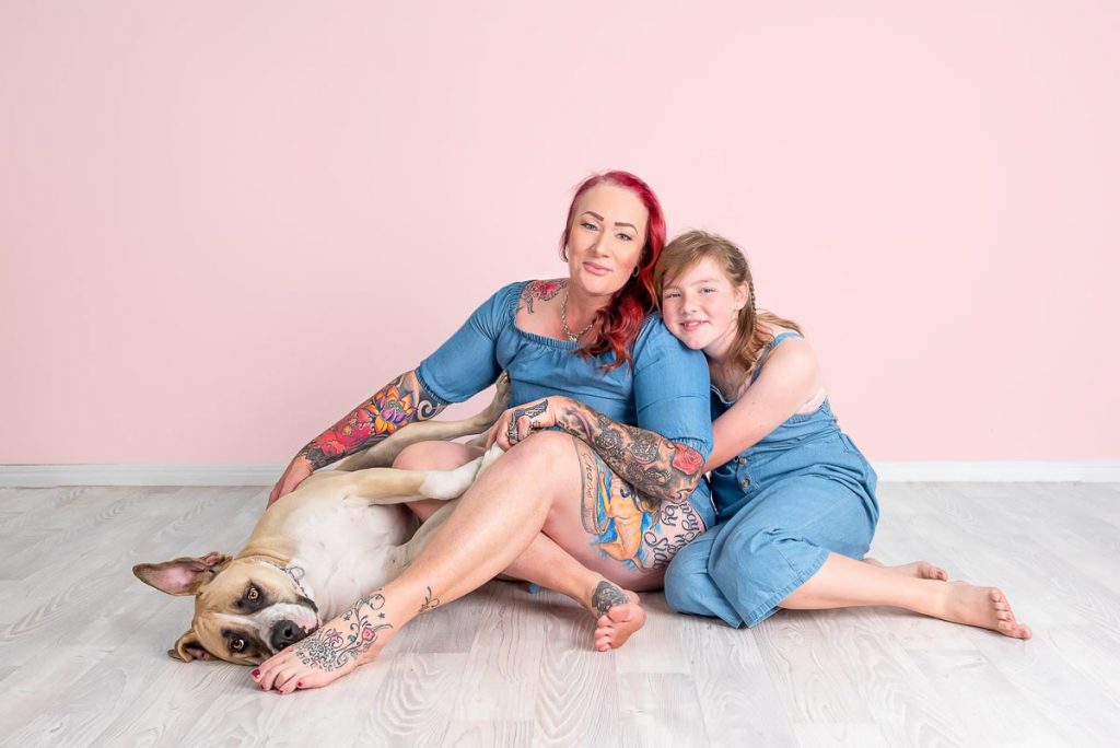 mom daughter and dog with pink wall in modern studio pet photography brisbane gold coast australia